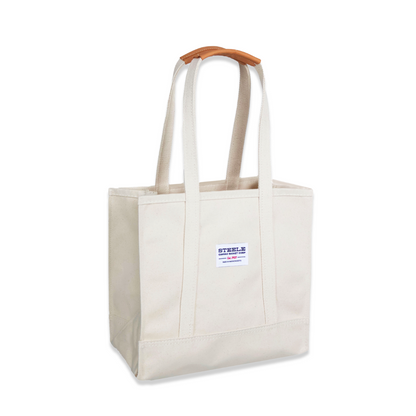 Beige tote bag with wooden handle on a white background