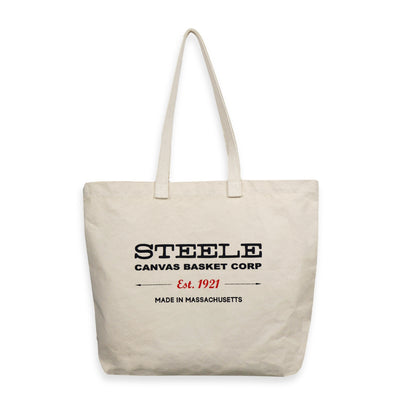 Beige tote bag with 'Steele Canvas Basket Corp' text on a white background