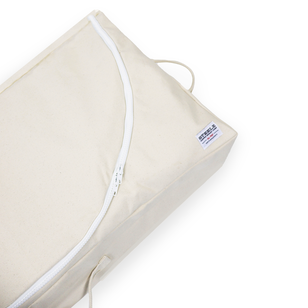 Beige pillow with white zipper on a white background