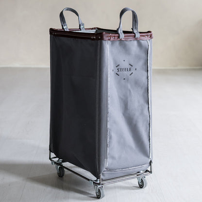 Two-toned laundry cart with a visible brand logo on a neutral background