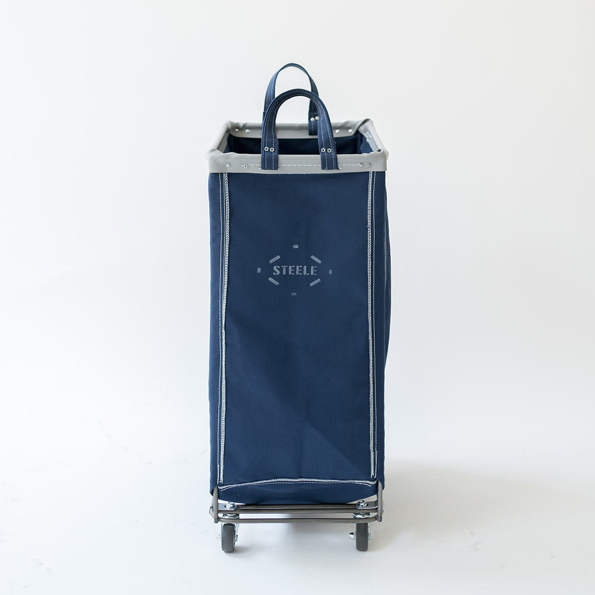 A navy blue fabric rolling laundry hamper with gray trim and silver metal wheels, featuring a top handle and a white printed 'STEEL' logo on the front, set against a plain white background.