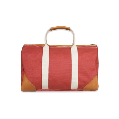 Red bag with white straps and brown accents on a white background