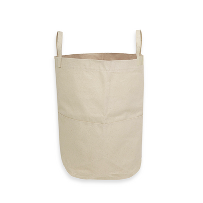 back side of a tall canvas storage bag with handles on a white background