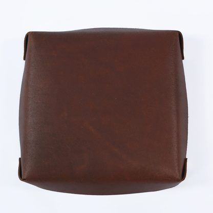 Brown leather bag on a white background