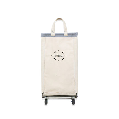 natural canvas laundry cart with 'STEELE' branding on a white background