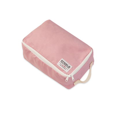 A pink zippered travel organizer bag with a beige handle and a white label, shown on a plain white background.